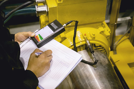 image of a man recording balancing data